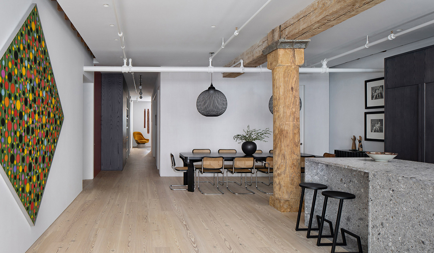 Worrell Yeung contrasts wood pillars and grey marble in Chelsea Loft